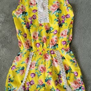Girls yellow & floral romper with lace detail & front tie.